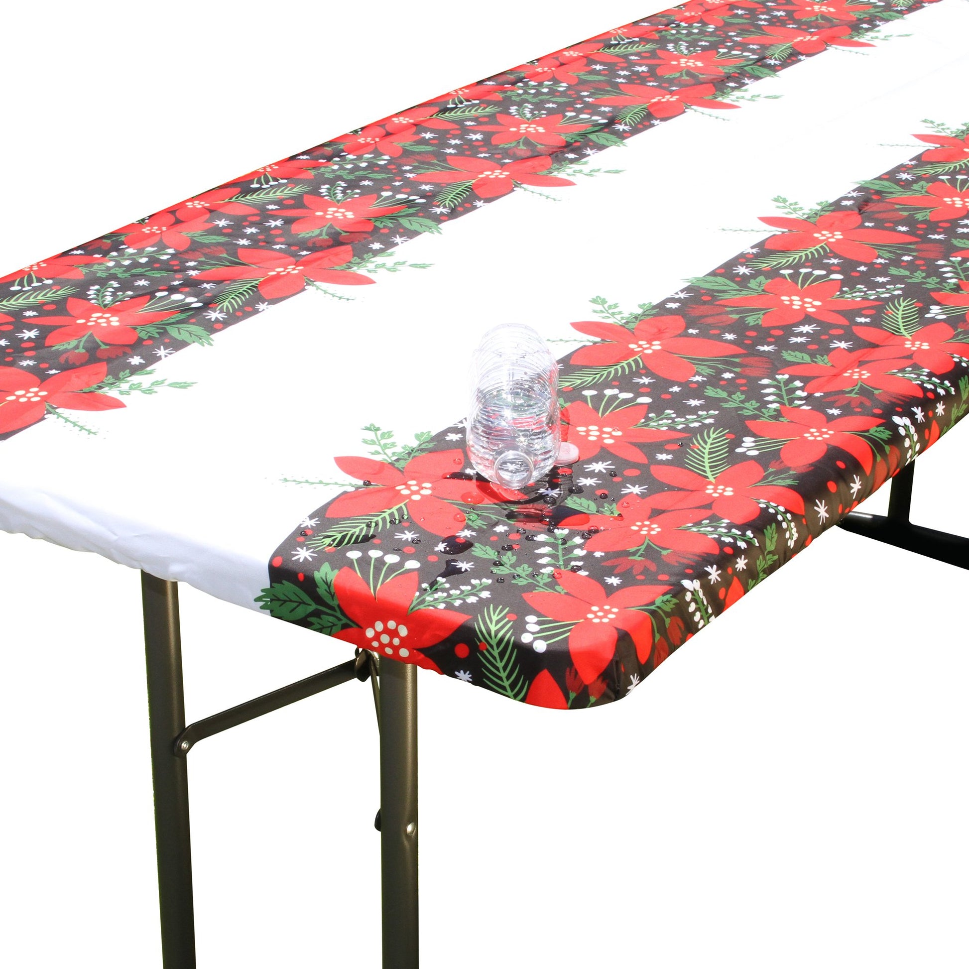 Water beading up on the water resistant surface of TableCloth PLUS 72" Winter Fitted Polyester Tablecloth for 6' Folding Tables