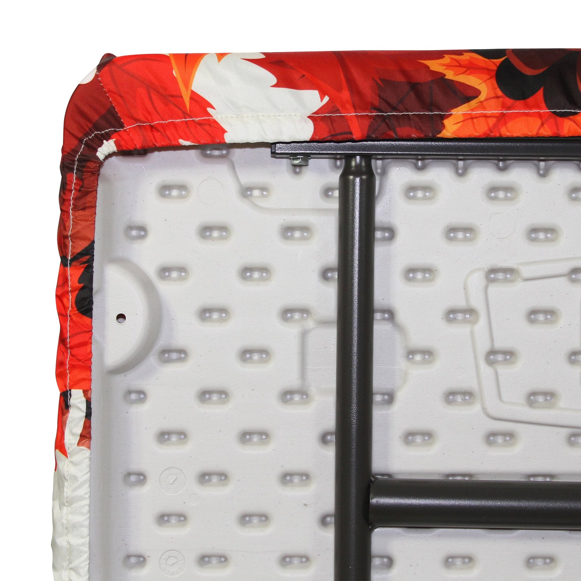 A closeup of a TableCloth PLUS 72" Fall Fitted Polyester Tablecloth for 6' Folding Tables gripping a folding table around the entire table edge
