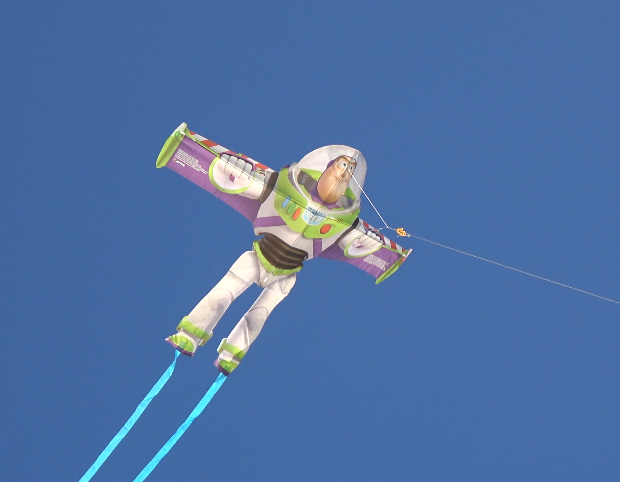 A photo of a WindNSun SuperSize Ultra Buzz Lightyear Ripstop Nylon Figure Kite Flying