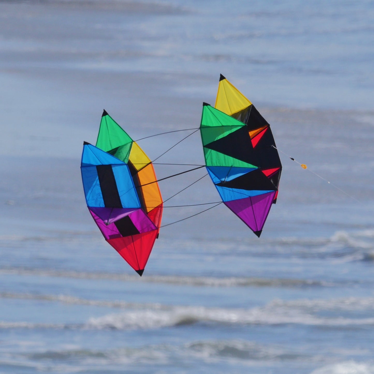 A photo of a WindNSun SuperSize Cellular SpinBox Ripstop Nylon Cellular Kite flying