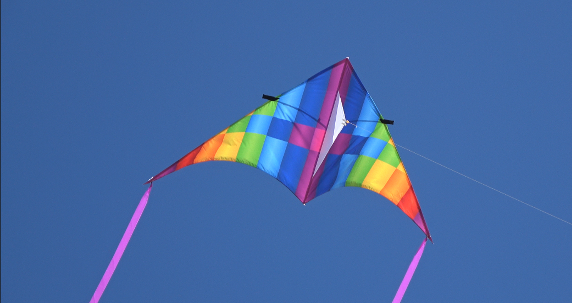 A photo of a WindNSun SuperSize Ultra 100 inch Delta - Pixel Ripstop Nylon Delta Kite Flying